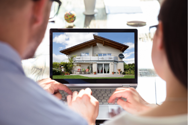 Couple peruse real estate in hopes of accomplishing dream of buying a house
